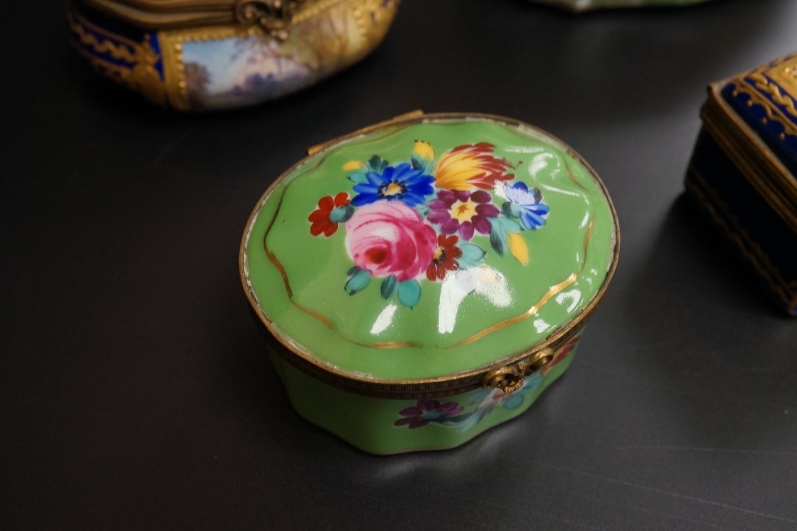 A collection of Continental hand painted and enamelled patch boxes, largest 9cm wide